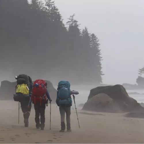 three people hiking west coast trail